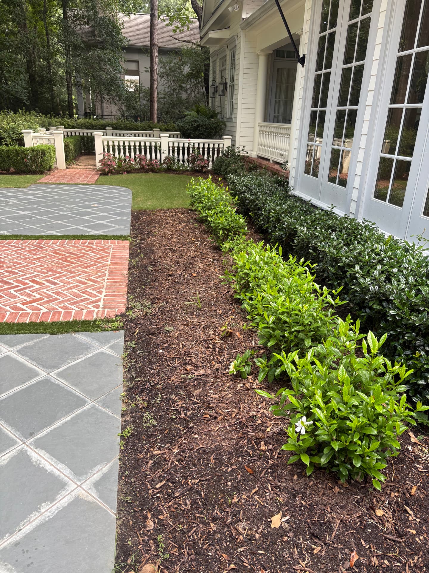 Tidy mulch and shrub beds along a home's walkway — Integrative Services, Montgomery TX