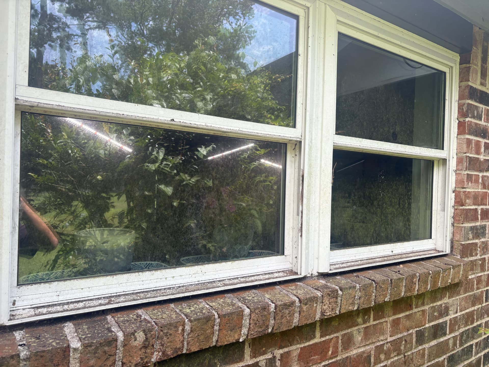 Brick home windows covered in dirt before a clean — Integrative Services, Montgomery TX