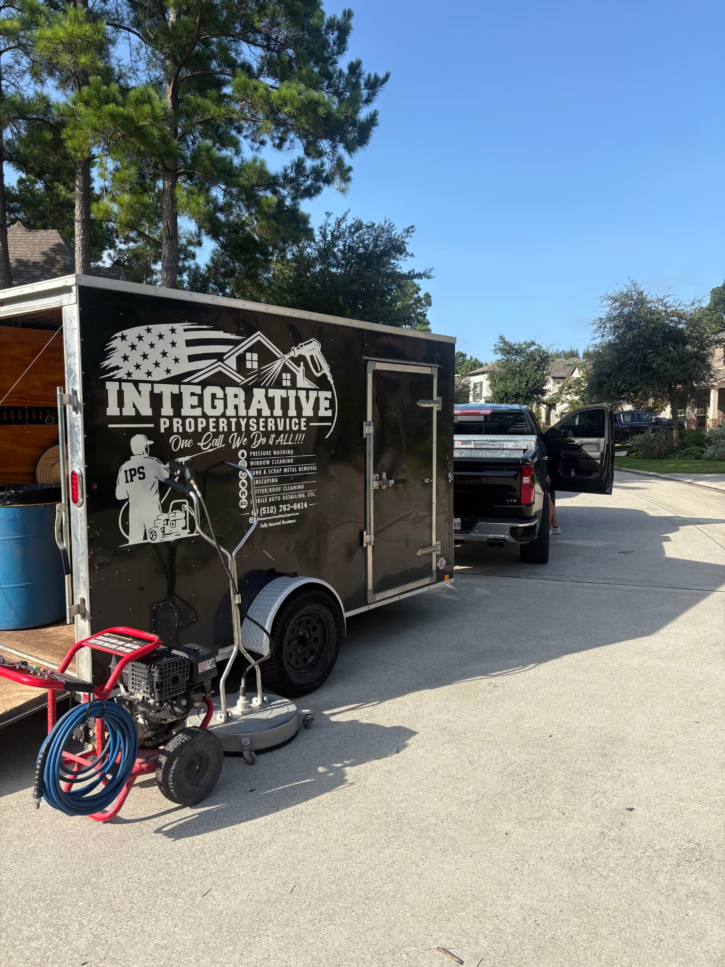 Integrative trailer hitched to a truck with pressure washing gear — Integrative Services, Montgomery TX