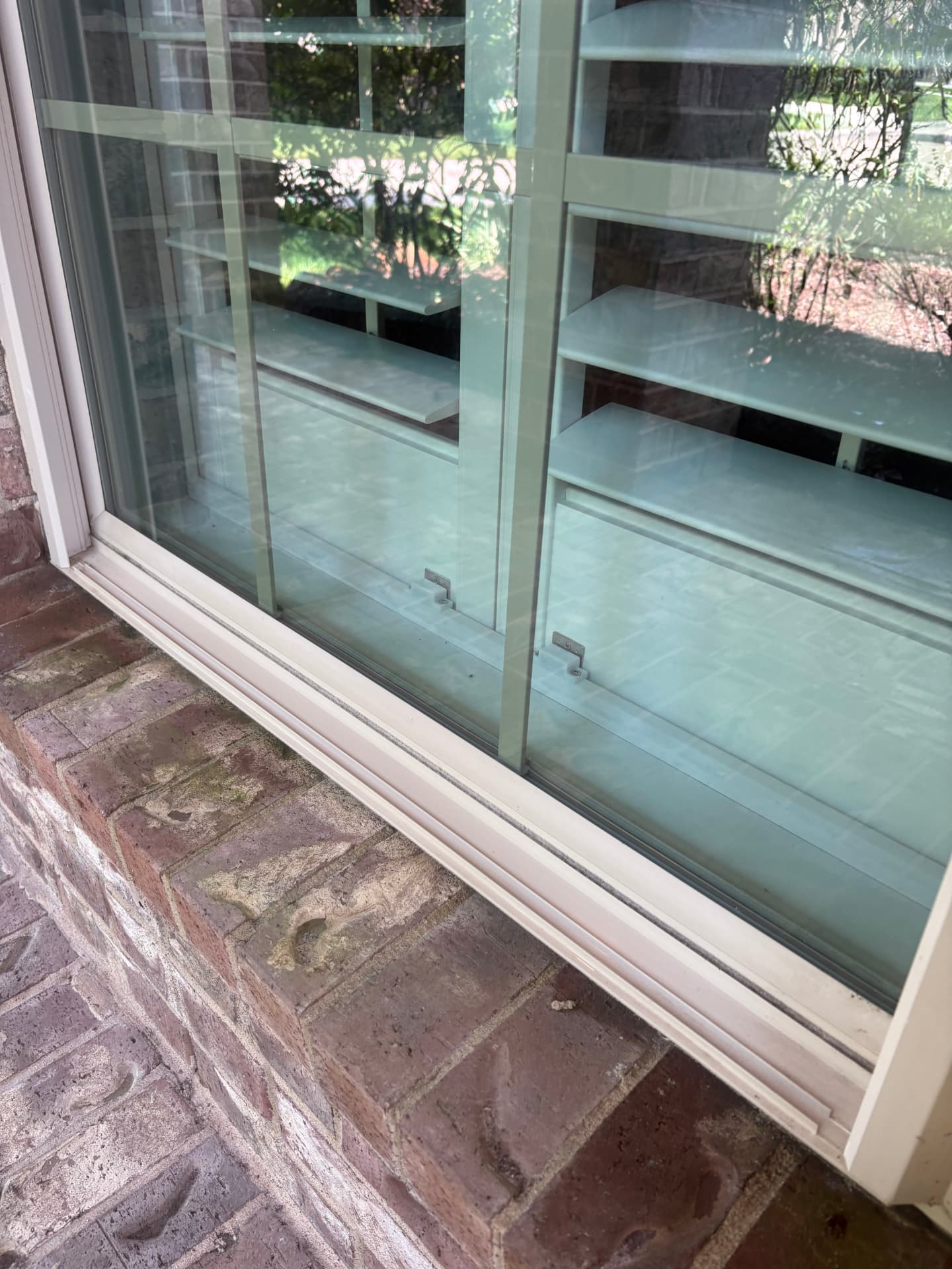 Window track on a brick sill after a clean — pressure washing in Montgomery, TX